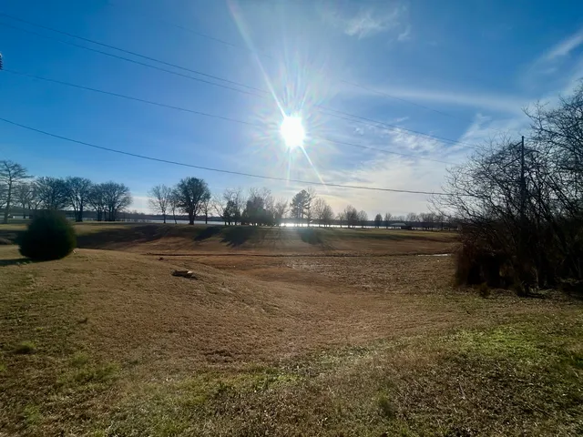 a view of lake with green space