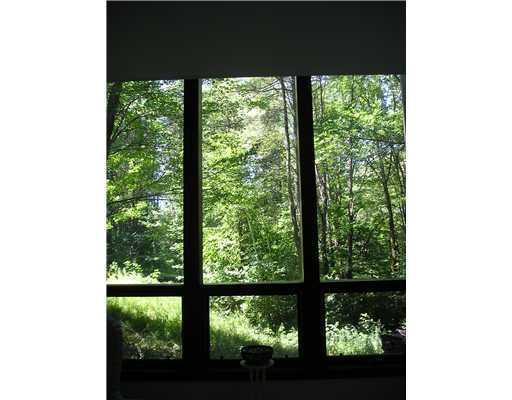 11 Tarkiln Hill Road Raymond, ME 04071 - Photo 10 of 12 Exterior Back. A wall of floor to...
