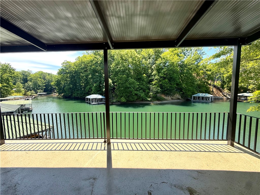 1200 Loran Pointe Circle Seneca, SC 29672 - Photo 2 of 29 Enjoy tranquil water views from this expansive patio, perfect for outdoor living and entertaining.