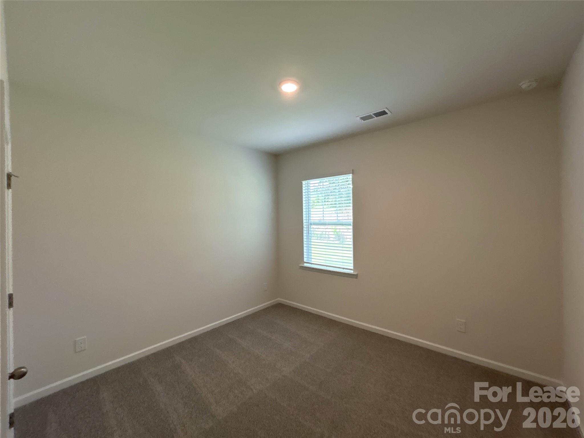 1920 Vanderlyn Street Monroe, NC 28112 - Photo 12 of 24 an empty room with a window