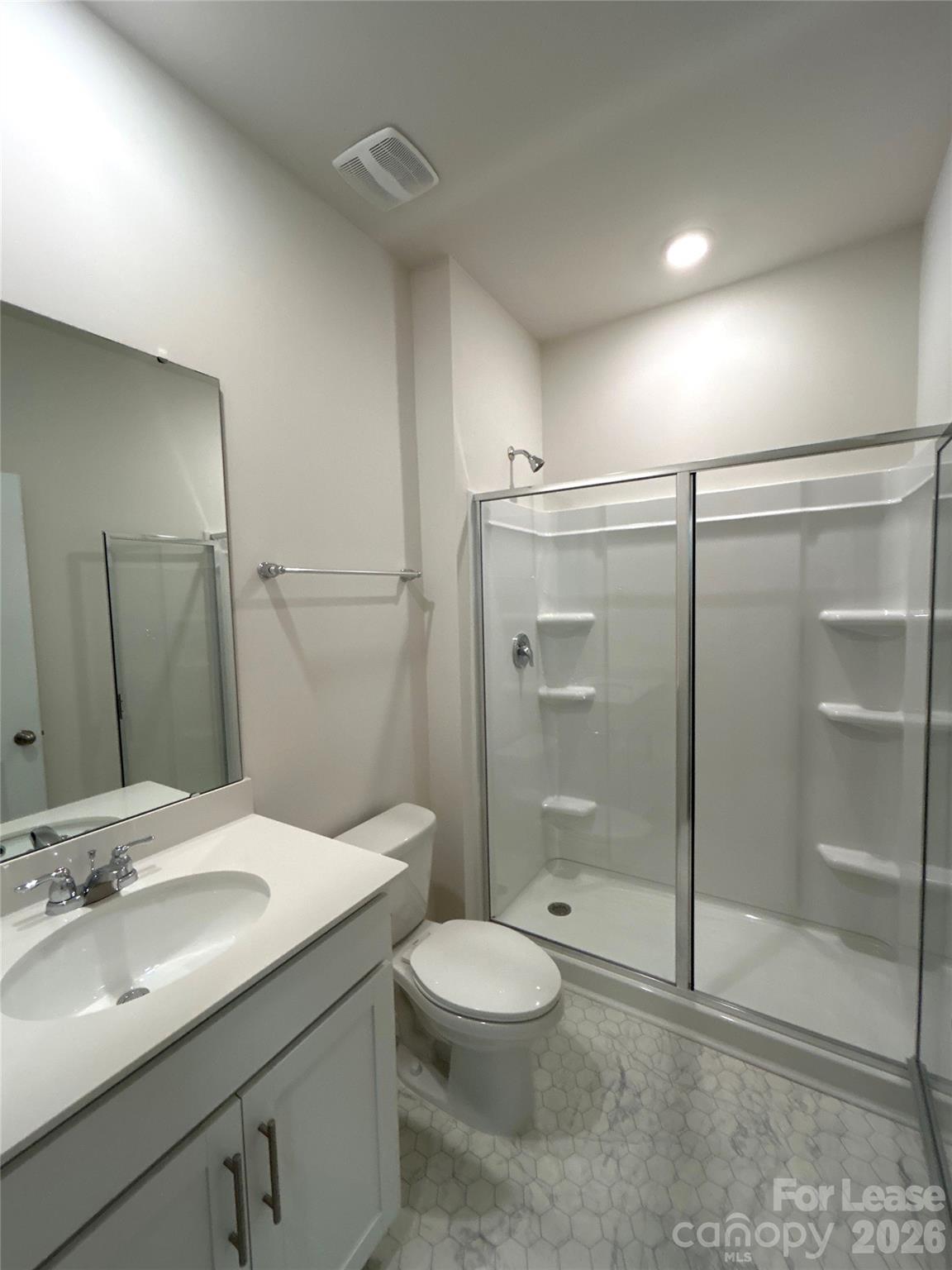 1920 Vanderlyn Street Monroe, NC 28112 - Photo 13 of 24 a bathroom with a shower sink vanity mirror and toilet