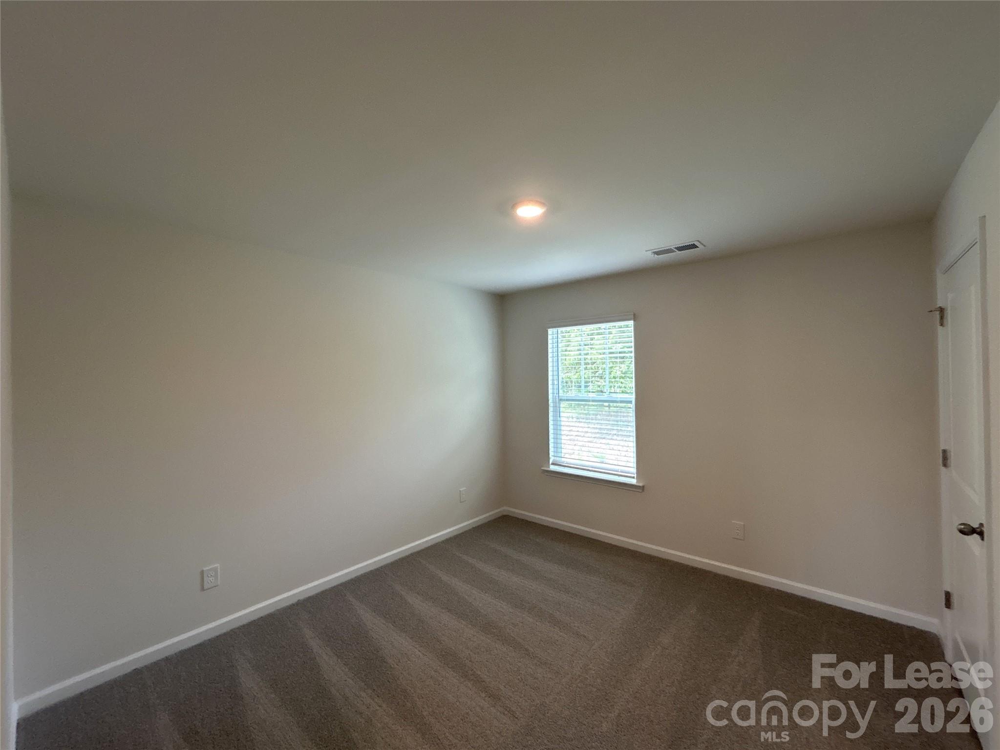 1920 Vanderlyn Street Monroe, NC 28112 - Photo 17 of 24 an empty room with a window