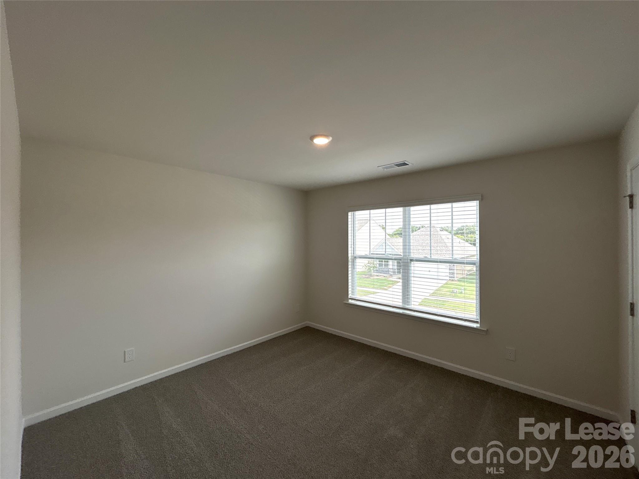 1920 Vanderlyn Street Monroe, NC 28112 - Photo 18 of 24 an empty room with a window