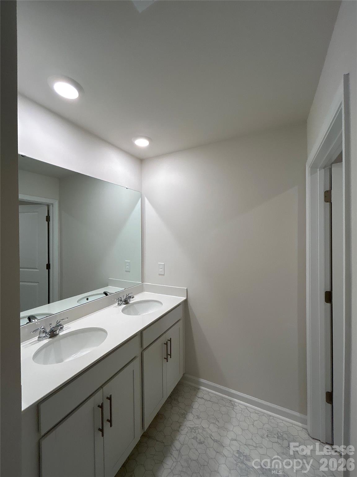 1920 Vanderlyn Street Monroe, NC 28112 - Photo 19 of 24 a bathroom with a double vanity sink and mirror