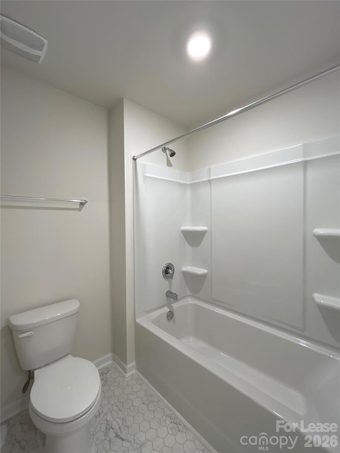 1920 Vanderlyn Street Monroe, NC 28112 - Photo 20 of 24 a white toilet sitting next to a bath tub
