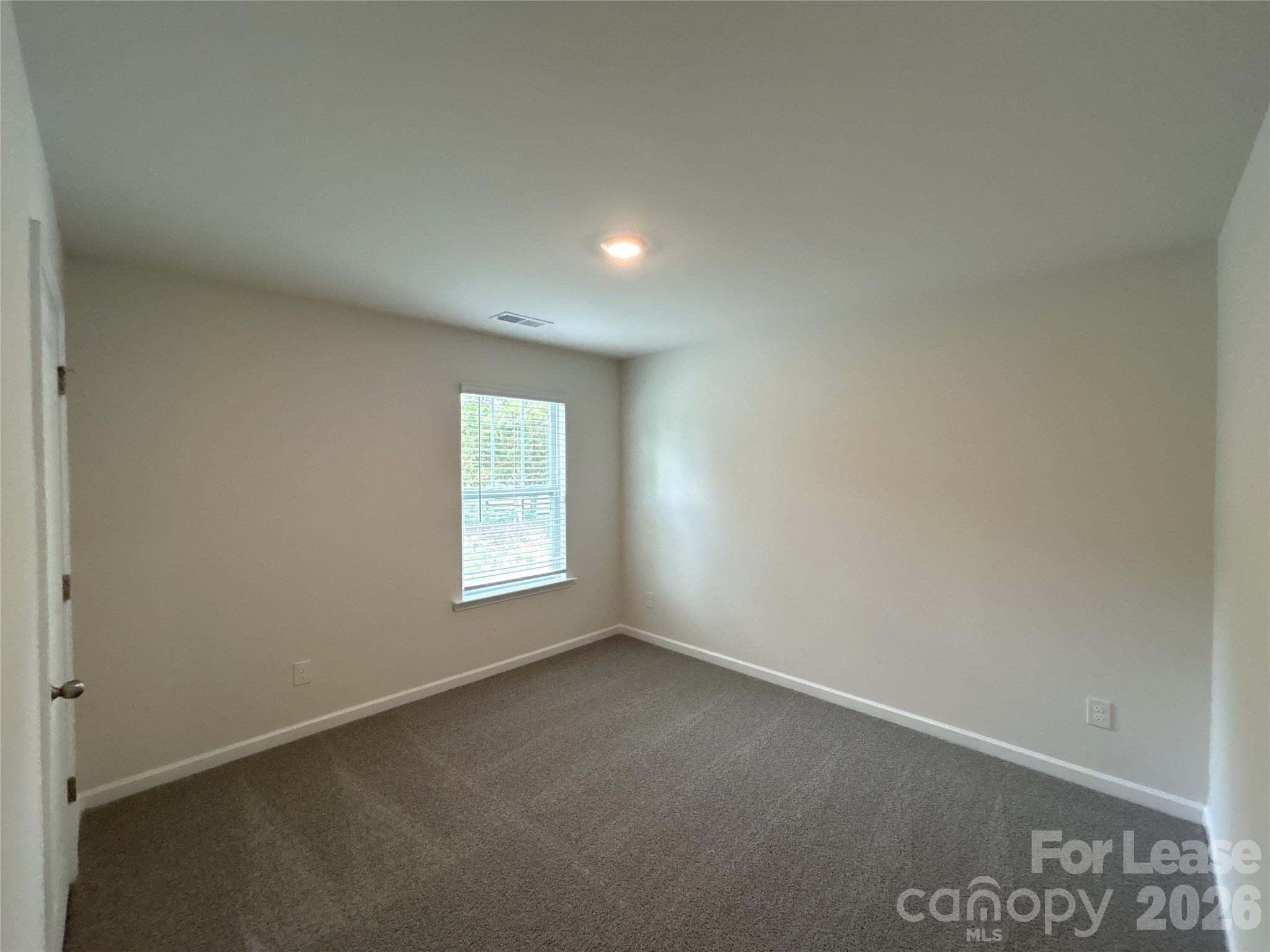1920 Vanderlyn Street Monroe, NC 28112 - Photo 21 of 24 an empty room with a window