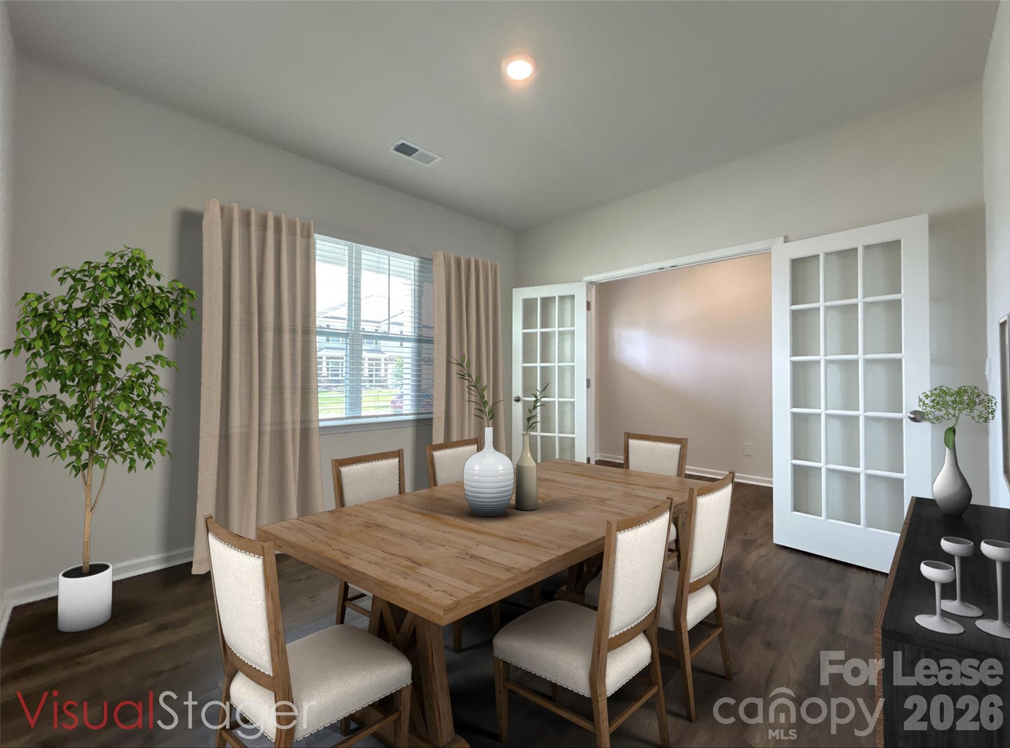 1920 Vanderlyn Street Monroe, NC 28112 - Photo 3 of 24 a view of a dining room with furniture window and wooden floor