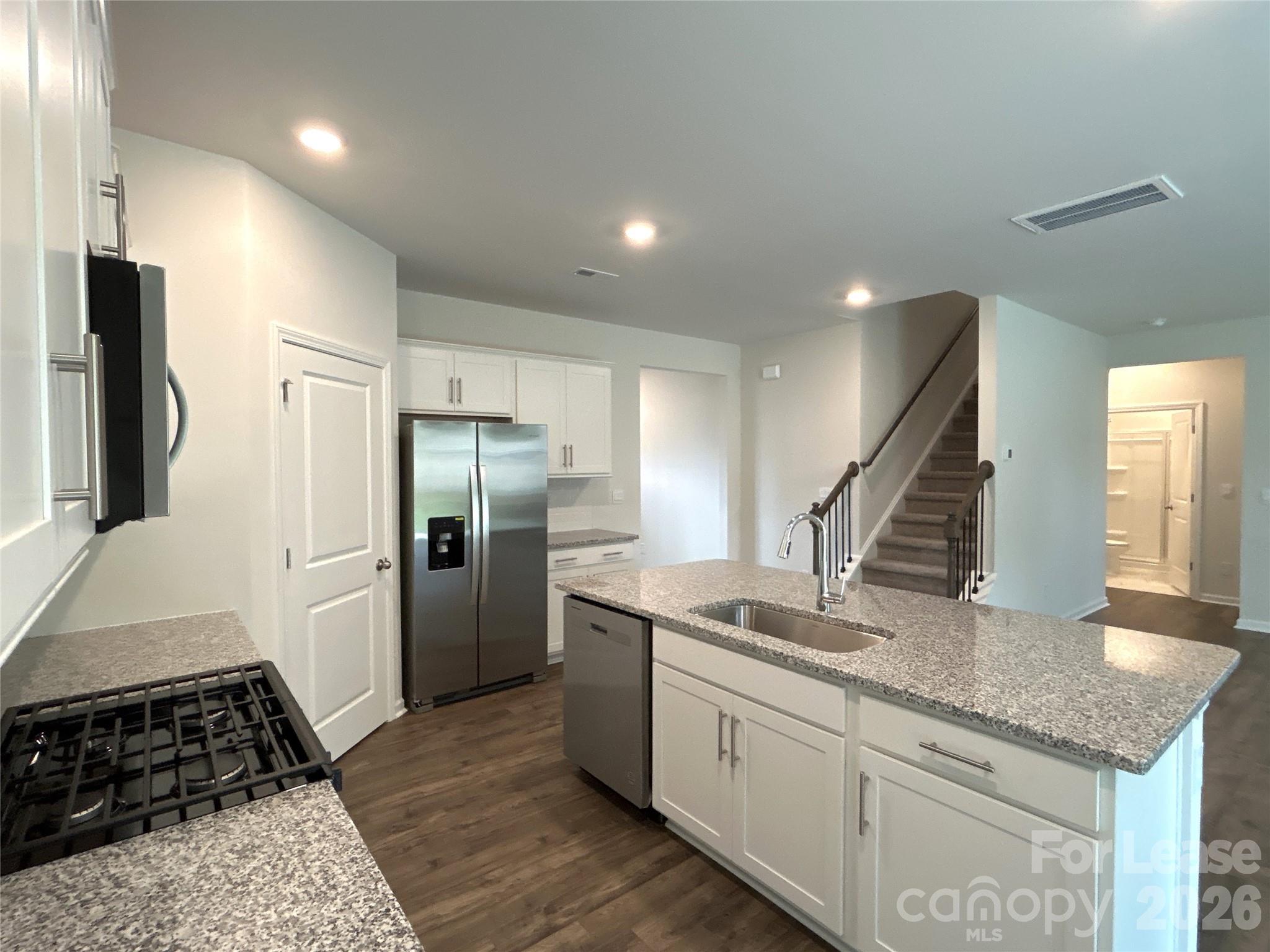 1920 Vanderlyn Street Monroe, NC 28112 - Photo 6 of 24 a kitchen with stainless steel appliances granite countertop a refrigerator and a sink