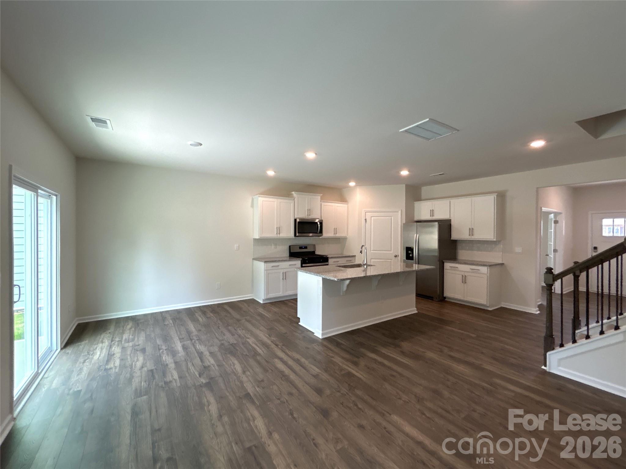 1920 Vanderlyn Street Monroe, NC 28112 - Photo 8 of 24 a view of kitchen with wooden floor and electronic appliances