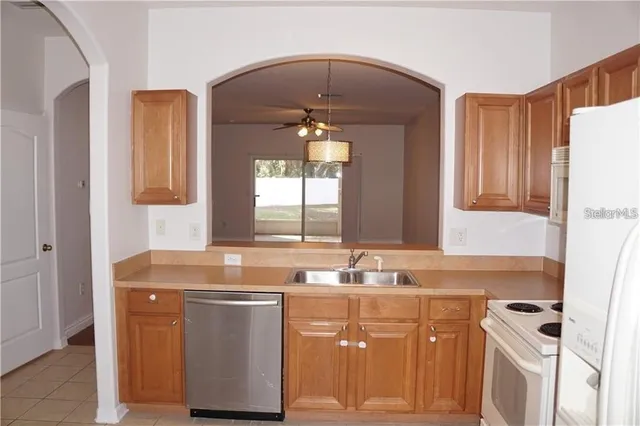 a bathroom with a sink vanity and mirror