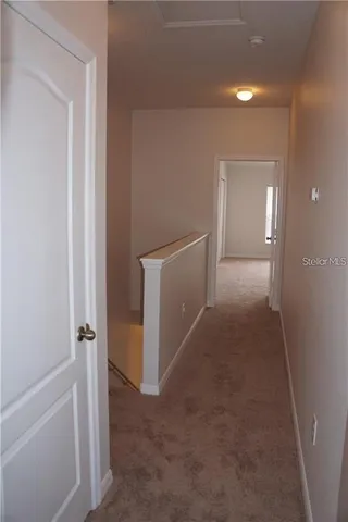 a view of a hallway with closet