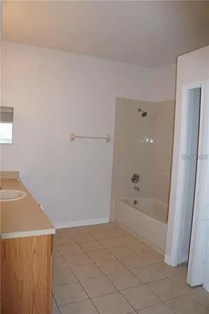 a bathroom with a bathtub and shower