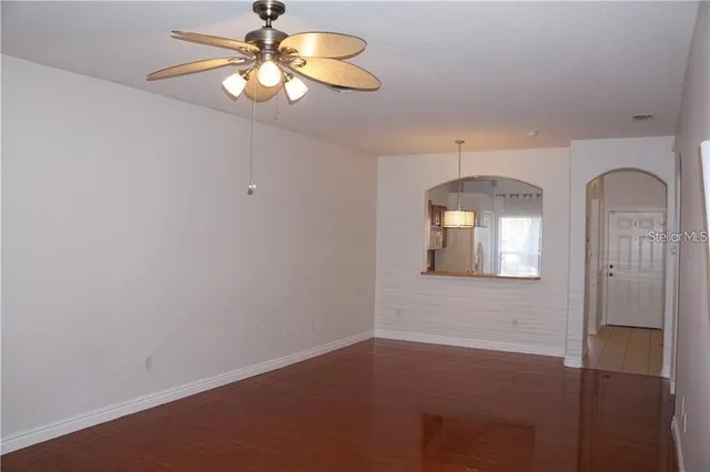 a view of a livingroom with a chandelier fan