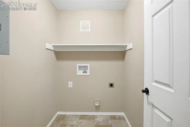 a aerial view of a house with a yard