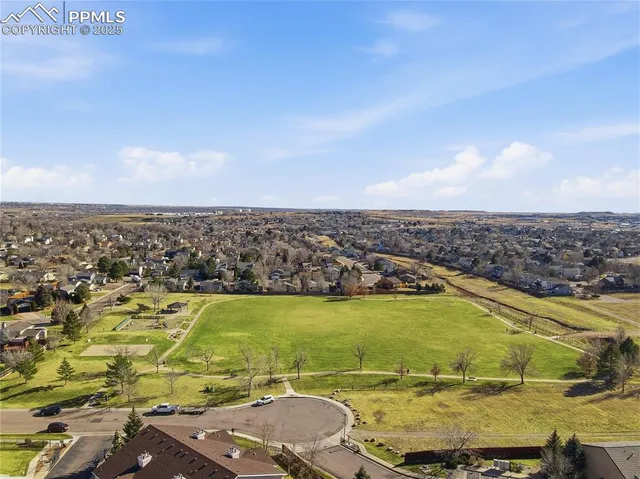 an aerial view of residential house and green space