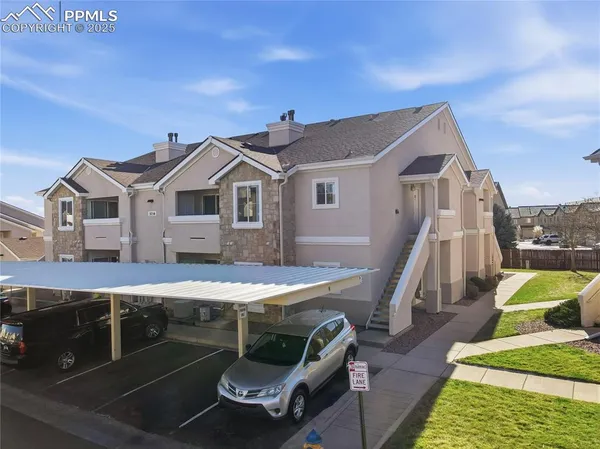 a patio with table and chairs