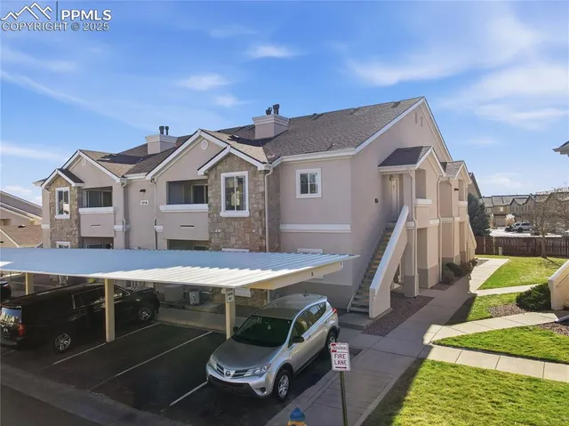 a patio with table and chairs