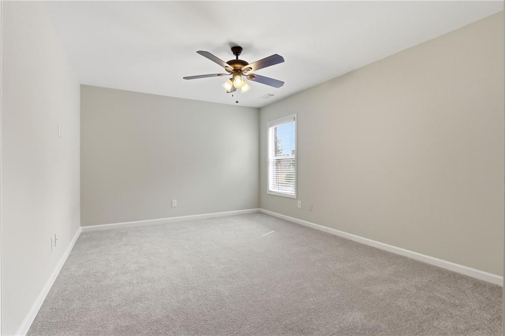 1515 Riva Ridge Suwanee, GA 30024 - Photo 27 of 35 a view of an empty room with a window