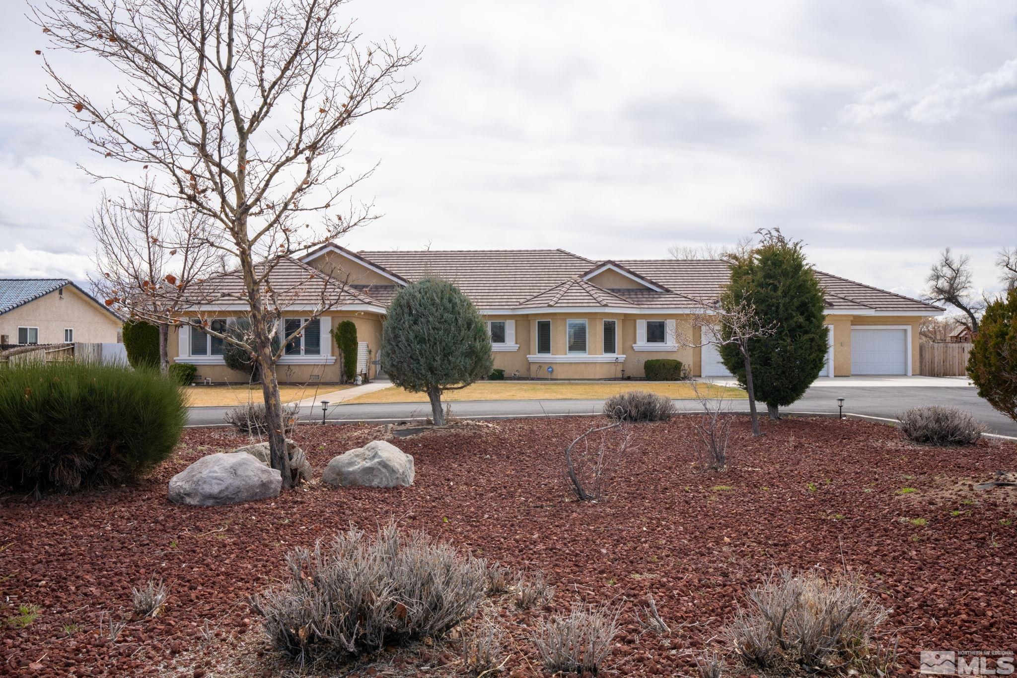 a front view of a house with garden