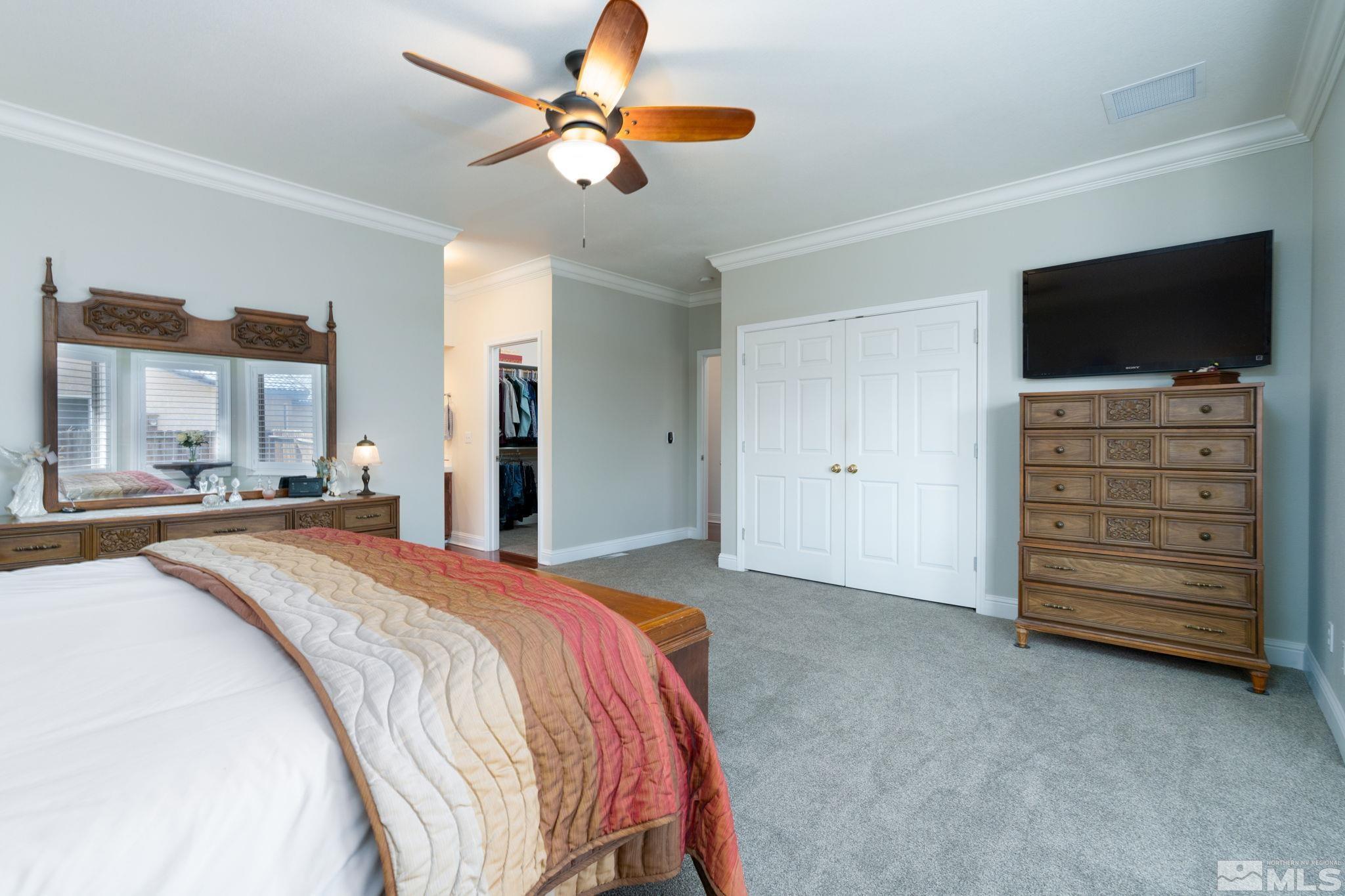 615 Carson River Drive Fallon, NV 89406 - Photo 18 of 40 a bedroom with a bed and a television