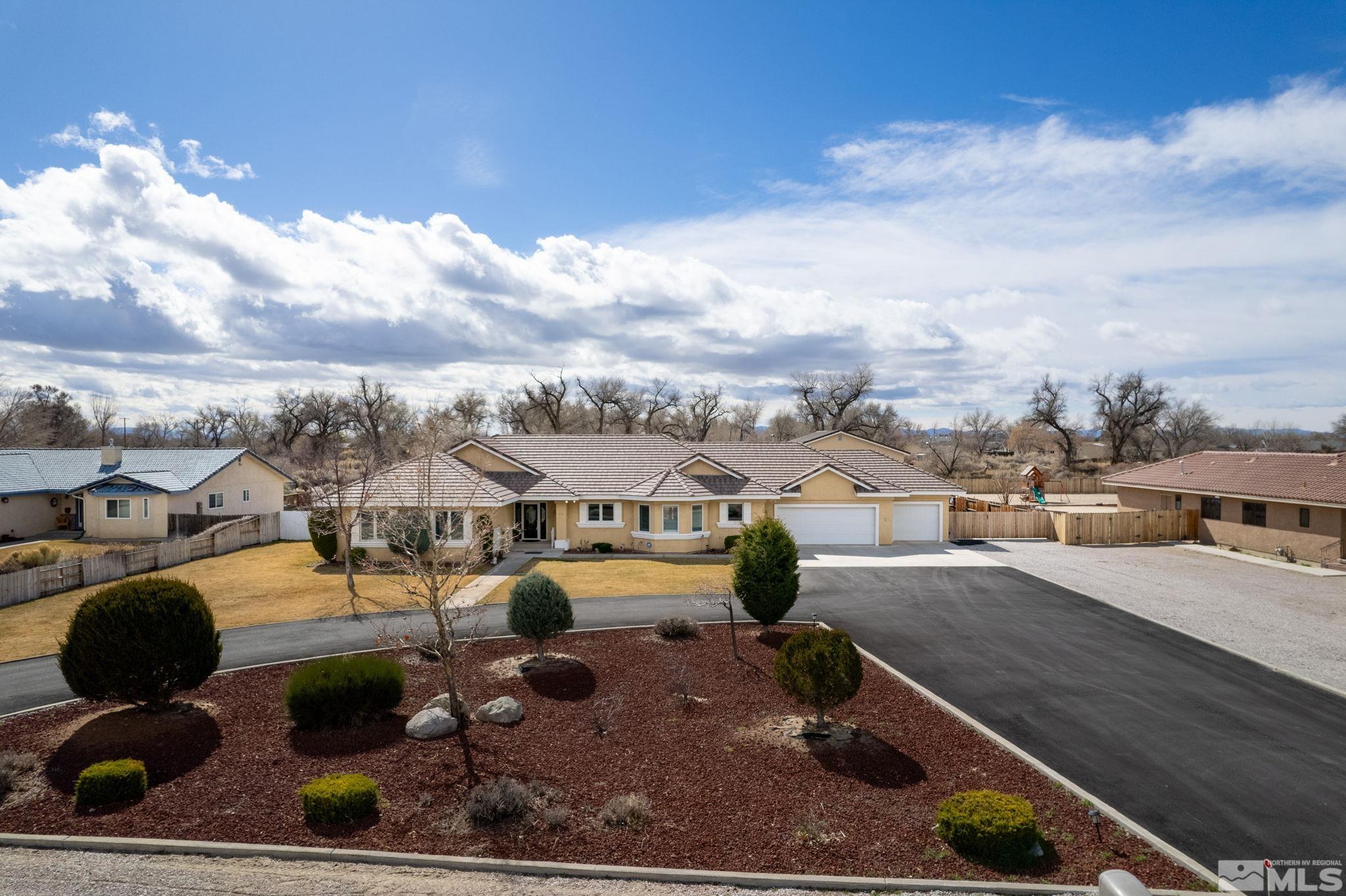 615 Carson River Drive Fallon, NV 89406 - Photo 2 of 40 a view of a swimming pool with seating area