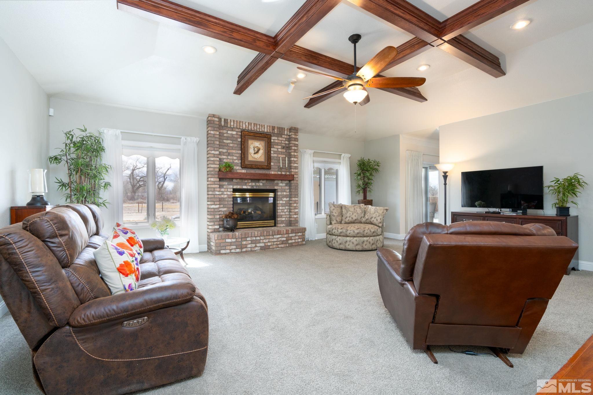 615 Carson River Drive Fallon, NV 89406 - Photo 5 of 40 a living room with furniture and a flat screen tv