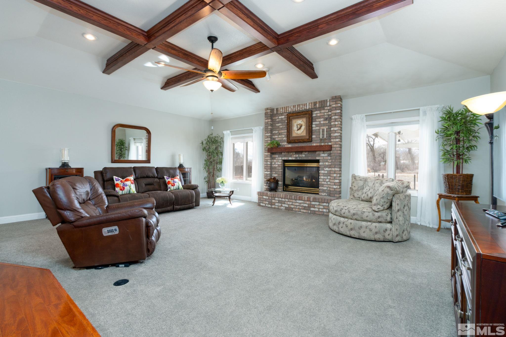 615 Carson River Drive Fallon, NV 89406 - Photo 6 of 40 a living room with furniture and a fireplace