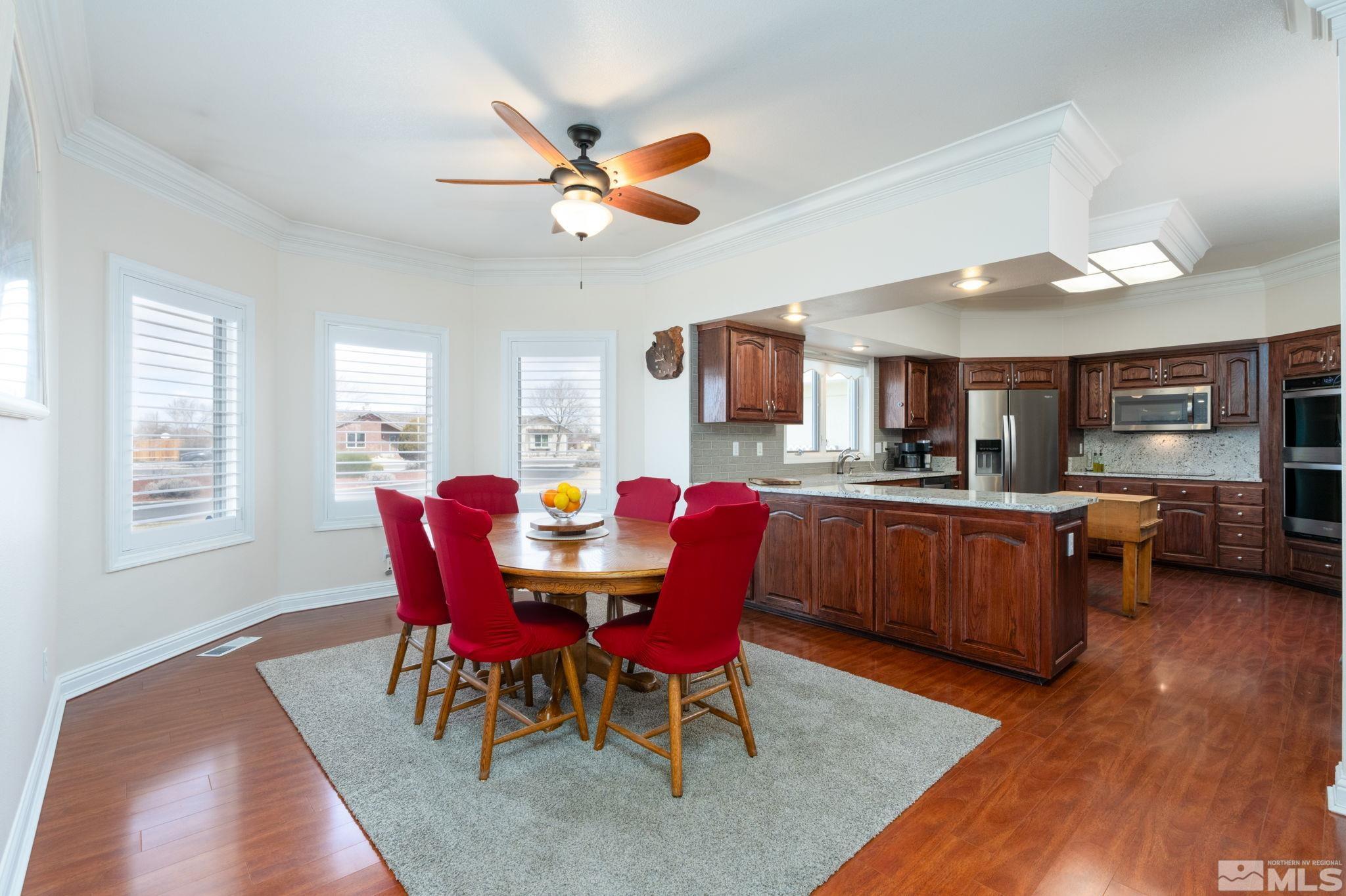 615 Carson River Drive Fallon, NV 89406 - Photo 10 of 40 a view of a dining room with furniture and wooden floor