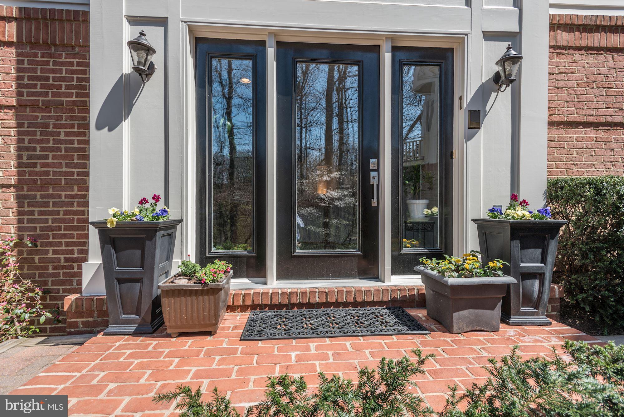 Brick Entry and Spring Flowers greet your guests