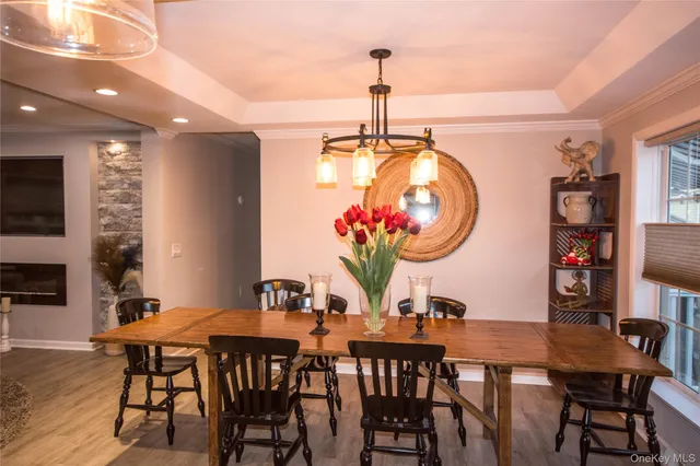 a dining room with furniture and window