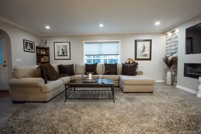 a living room with furniture and a window