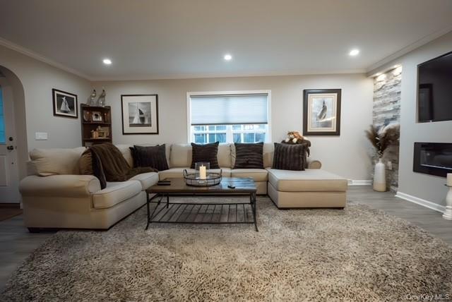 1661-519 Old Country Road, Unit 519 Riverhead, NY 11901 - Photo 5 of 17 a living room with furniture and a window
