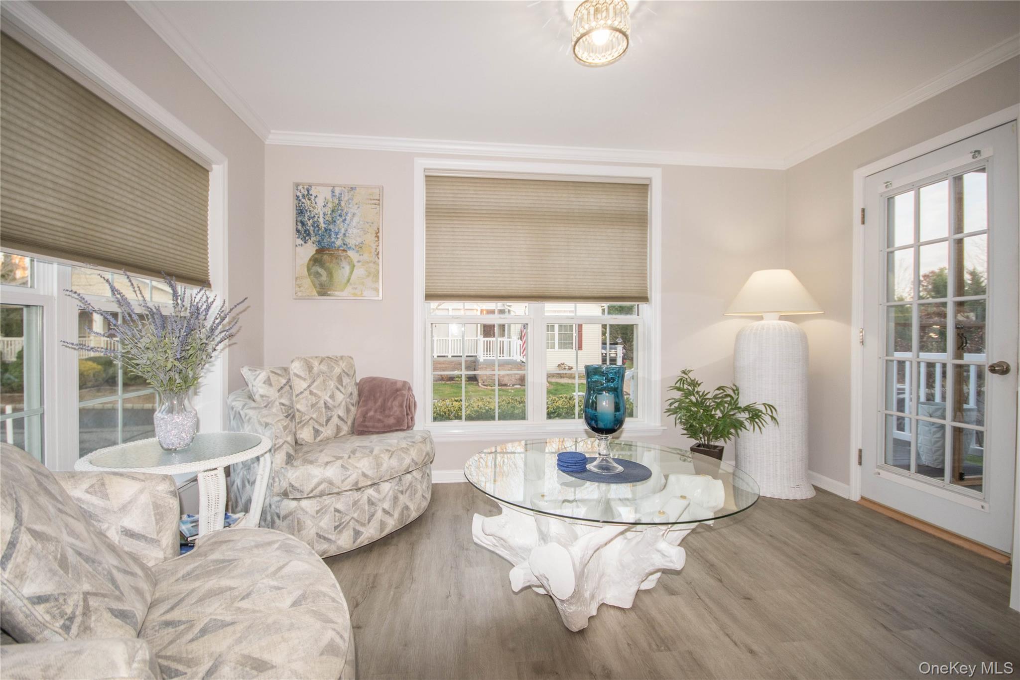 1661-519 Old Country Road, Unit 519 Riverhead, NY 11901 - Photo 6 of 17 a living room with furniture and a table