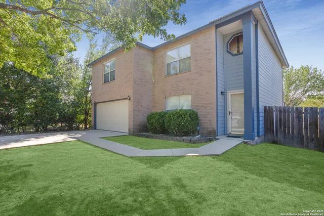 a view of a back yard of the house