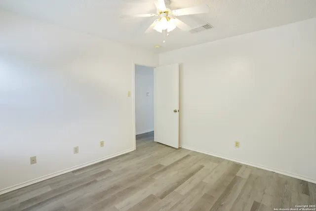 a view of a room with shelf on the wall