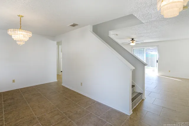 a view of a hallway with staircase