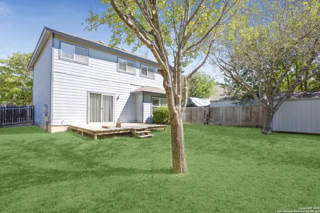 a backyard of a house with lots of green space