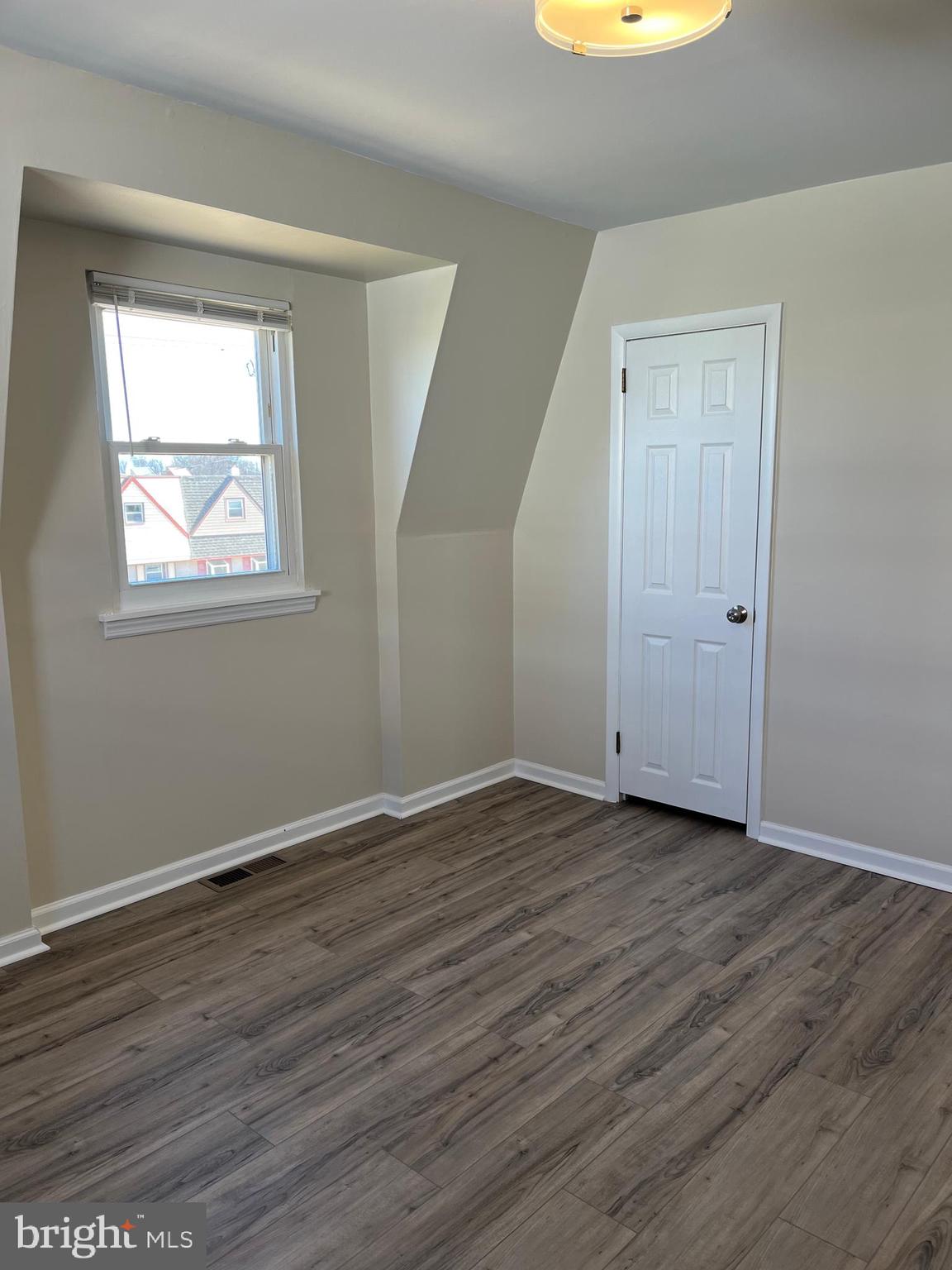 3464 Fitler Street Philadelphia, PA 19114 - Photo 13 of 22 an empty room with wooden floor and windows