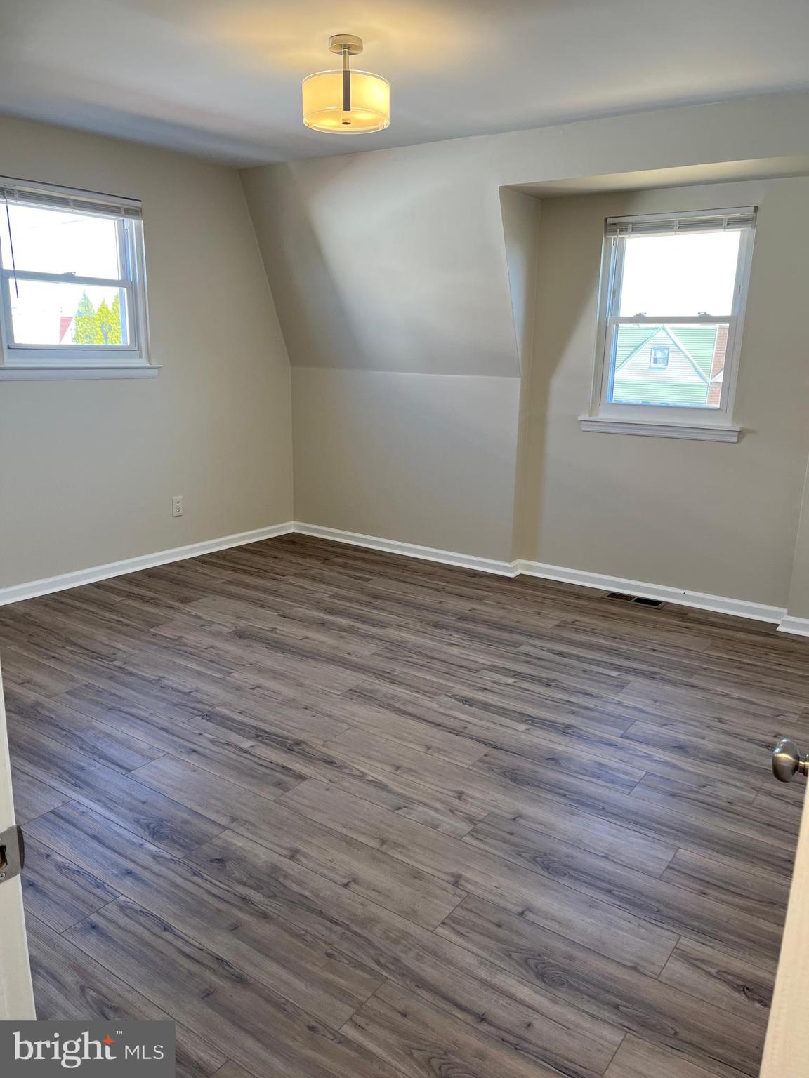 3464 Fitler Street Philadelphia, PA 19114 - Photo 15 of 22 an empty room with wooden floor and windows
