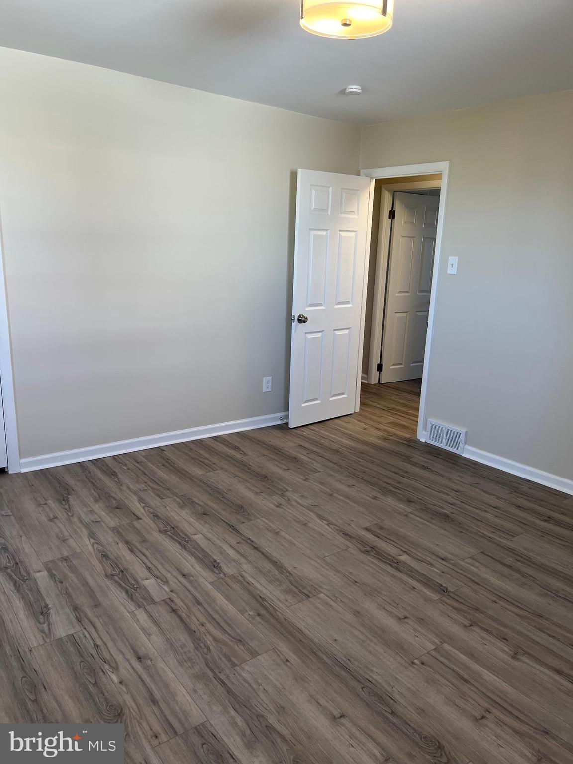 3464 Fitler Street Philadelphia, PA 19114 - Photo 17 of 22 a view of an empty room with wooden floor