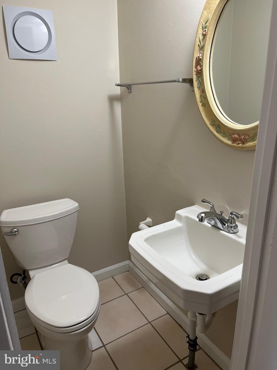 3464 Fitler Street Philadelphia, PA 19114 - Photo 19 of 22 a bathroom with a sink mirror and toilet