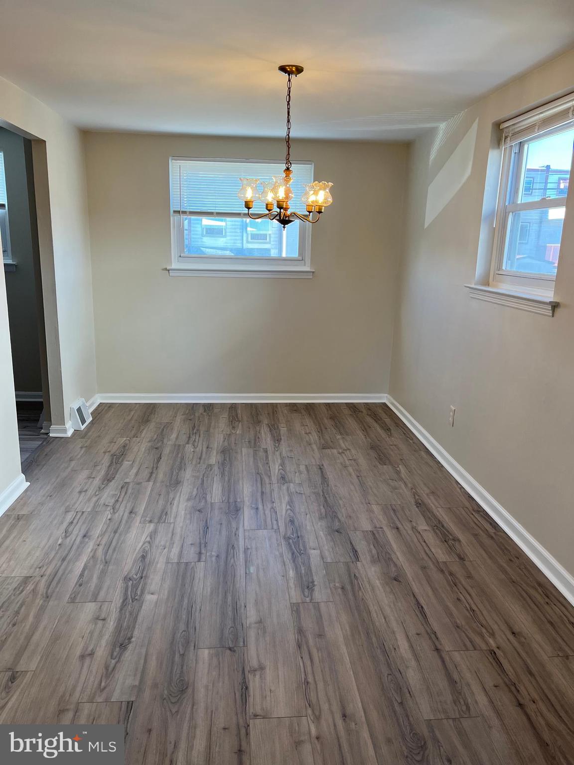 3464 Fitler Street Philadelphia, PA 19114 - Photo 2 of 22 an empty room with wooden floor and windows