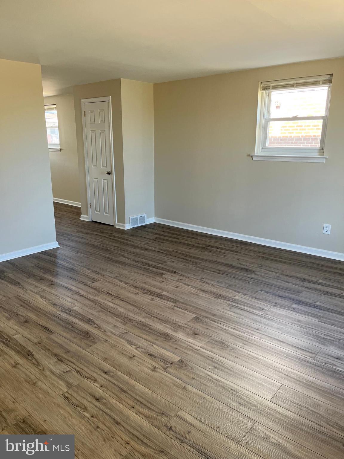 3464 Fitler Street Philadelphia, PA 19114 - Photo 3 of 22 a view of an empty room with wooden floor and a window