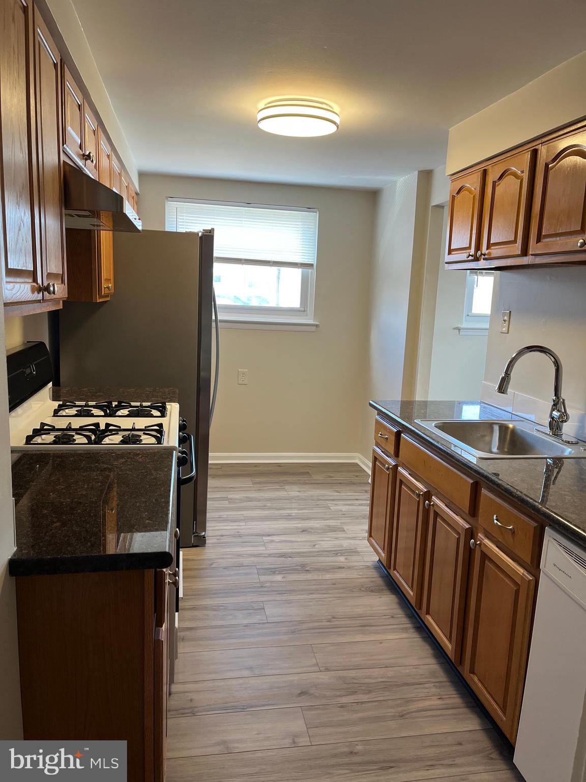 3464 Fitler Street Philadelphia, PA 19114 - Photo 6 of 22 a kitchen with stainless steel appliances granite countertop a refrigerator stove and sink