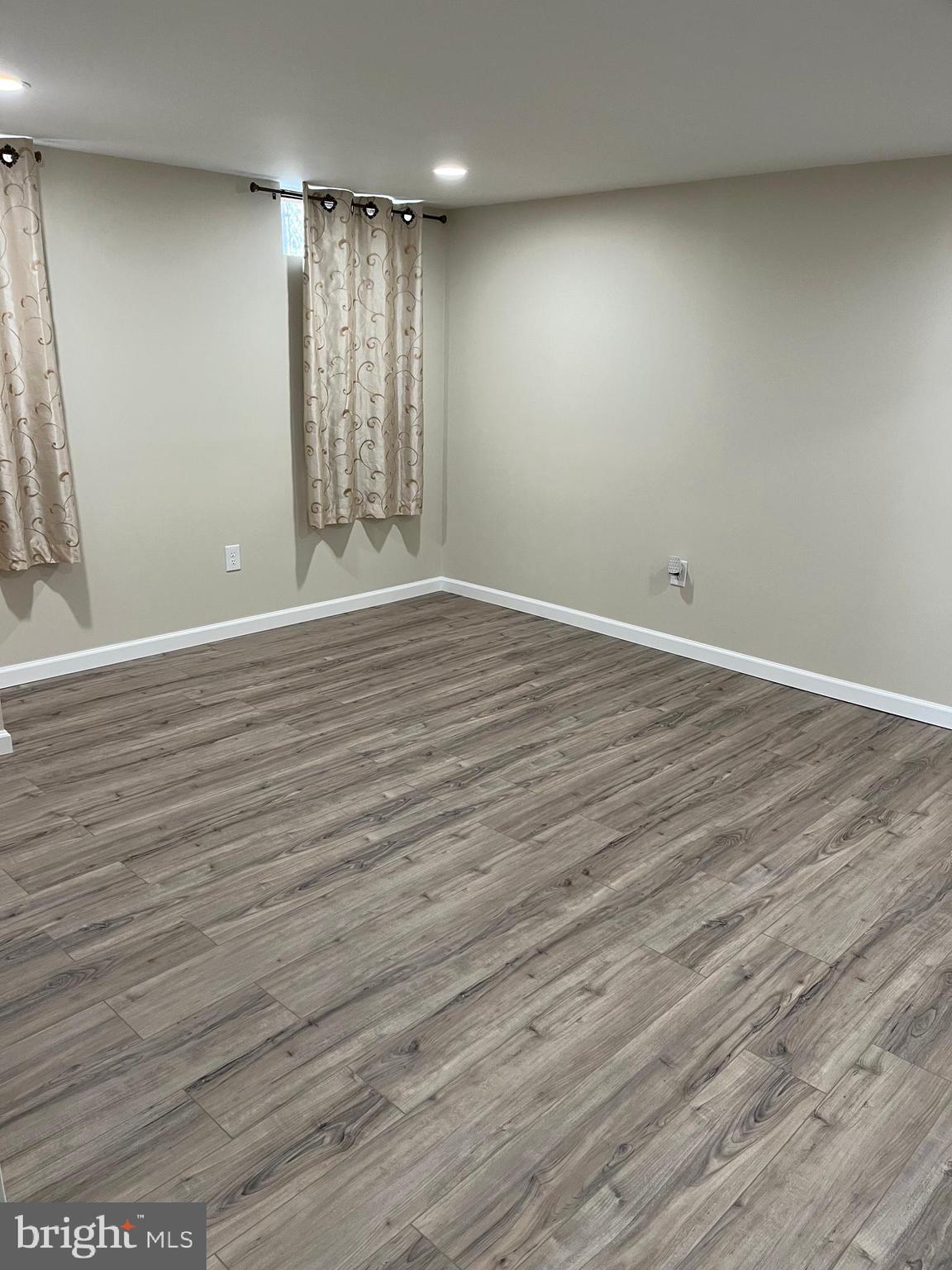 3464 Fitler Street Philadelphia, PA 19114 - Photo 9 of 22 an empty room with wooden floor and windows