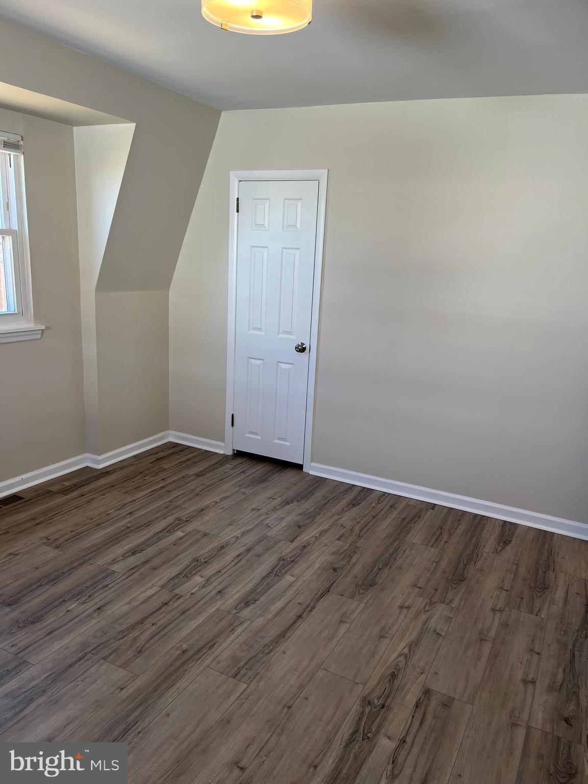 3464 Fitler Street Philadelphia, PA 19114 - Photo 10 of 22 a view of an empty room with wooden floor and a window