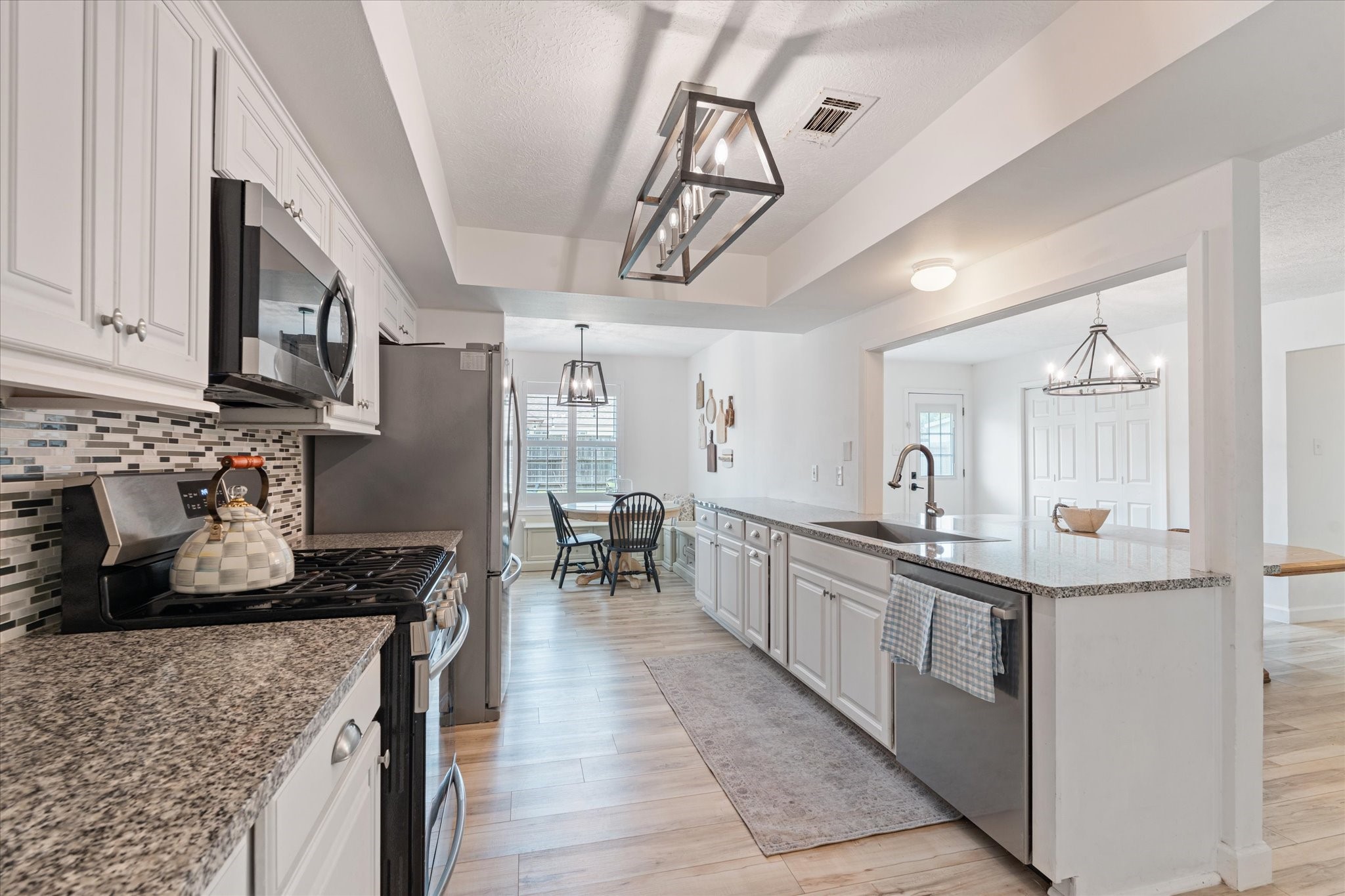 110 Dozent Lane Baytown, TX 77521 - Photo 11 of 36 a kitchen with stainless steel appliances granite countertop a sink and cabinets