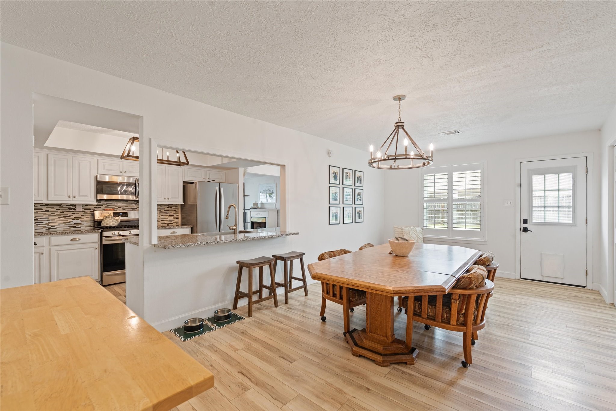 110 Dozent Lane Baytown, TX 77521 - Photo 12 of 36 a view of a dining room with furniture window and wooden floor