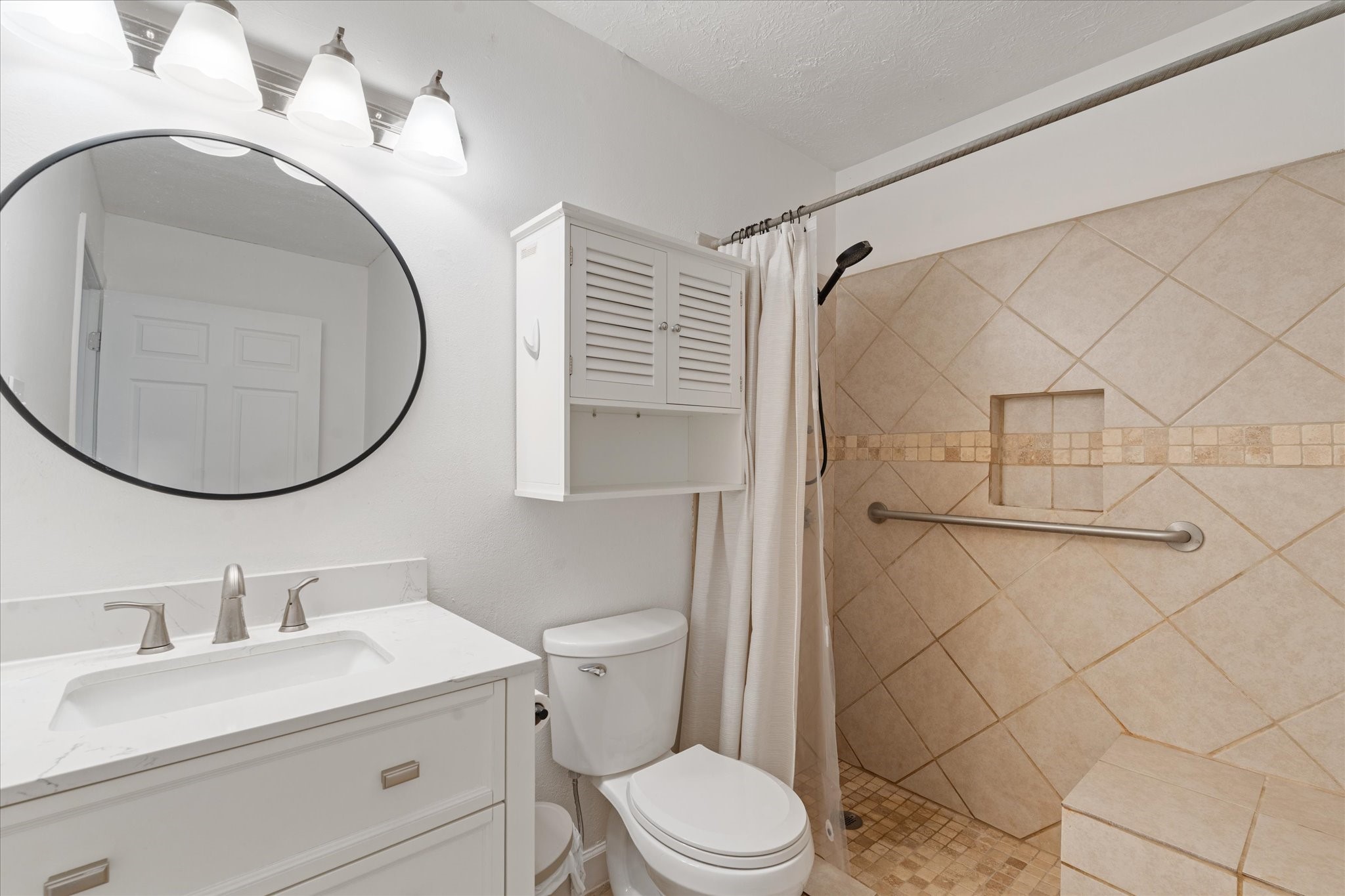 110 Dozent Lane Baytown, TX 77521 - Photo 15 of 36 a bathroom with a sink a toilet and a mirror