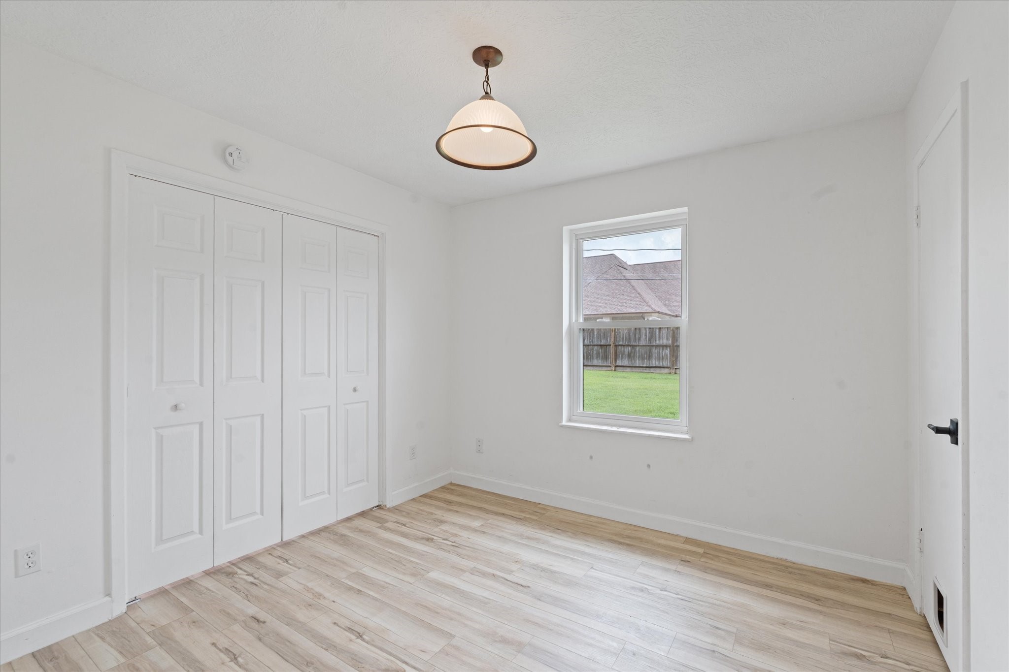 110 Dozent Lane Baytown, TX 77521 - Photo 21 of 36 wooden floor in an empty room with a window